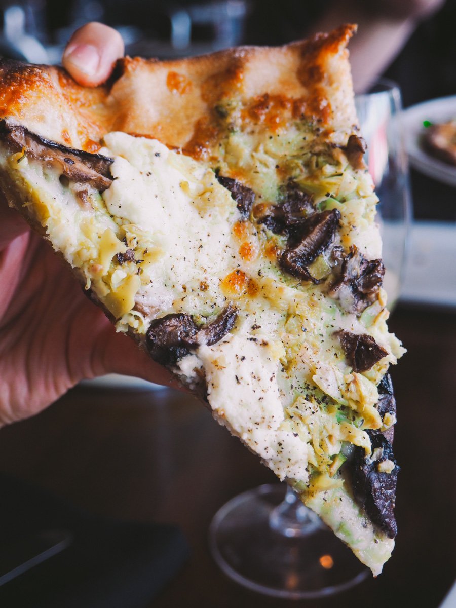 olive oyl pizza (pesto, roasted mushrooms, artichokes, olives, & melty pools of fresh ricotta) at red wagon pizza company in sw minneapolis via playswellwithbutter.com
