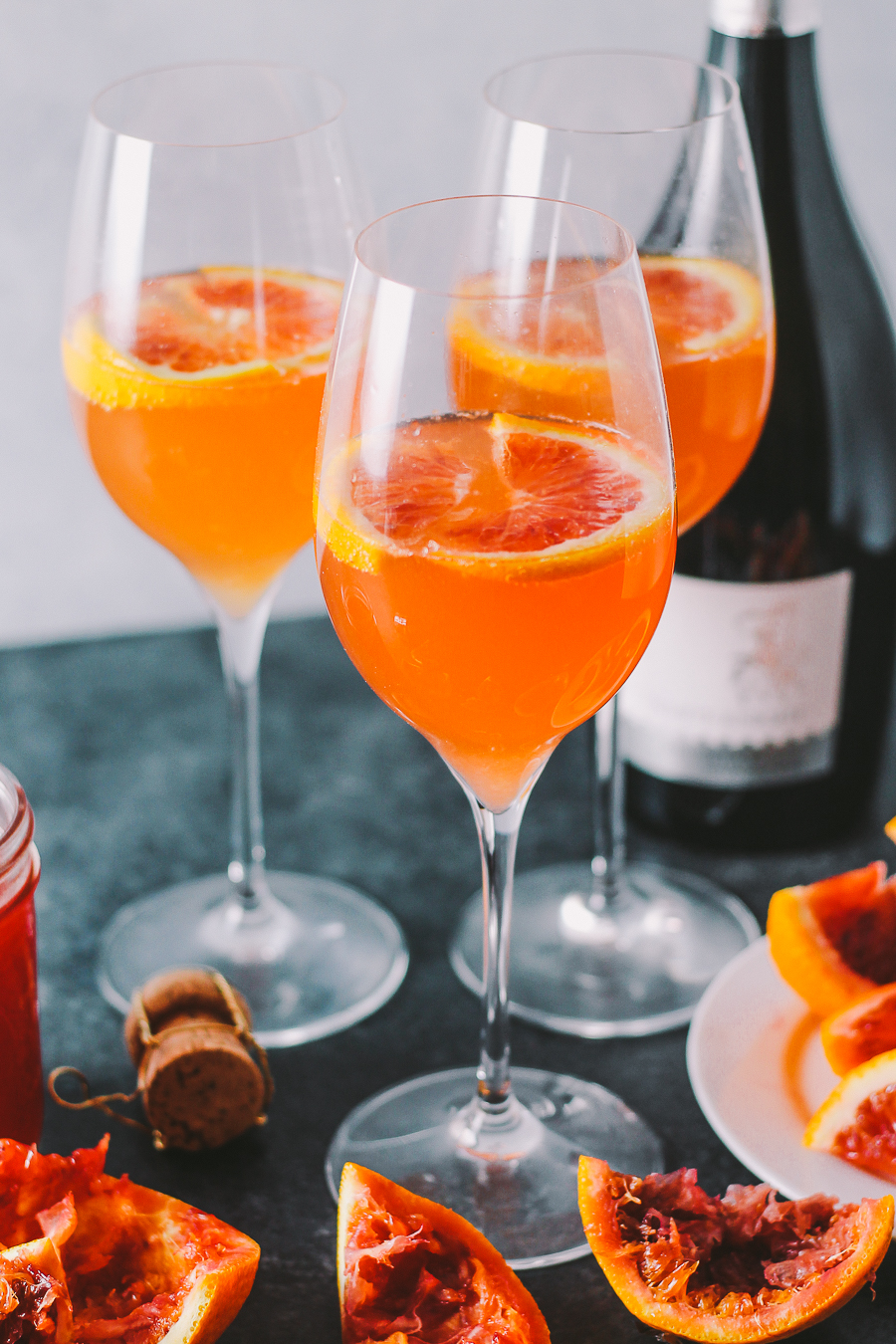 an update to a classic mimosa, these winter citrus mimosas are lightly sweetened with a homemade blood orange & honey syrup | mimosas | mimosa recipe | brunch cocktails | cocktails | cocktails recipe