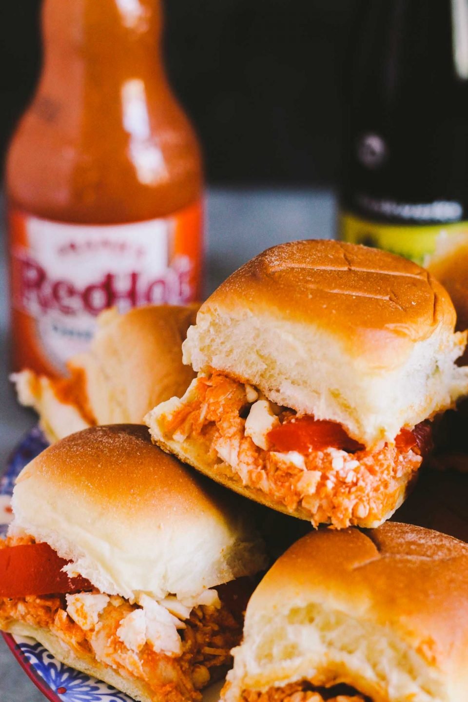 buffalo chicken sliders make the perfect game day snack & the best part is that they come together in 20 minutes from start to finish & feed a crowd of up to 12 people…it doesn’t get easier than that! | game day recipe, easy entertaining, buffalo chicken recipe, sliders recipe |
