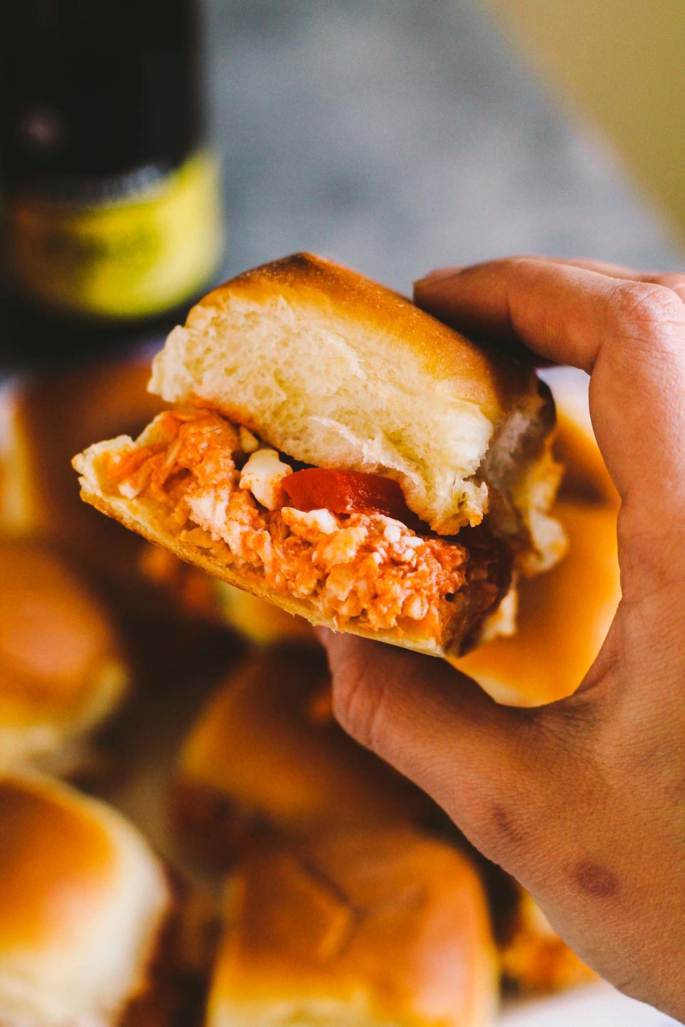 buffalo chicken sliders make the perfect game day snack & the best part is that they come together in 20 minutes from start to finish & feed a crowd of up to 12 people…it doesn’t get easier than that! | game day recipe, easy entertaining, buffalo chicken recipe, sliders recipe |