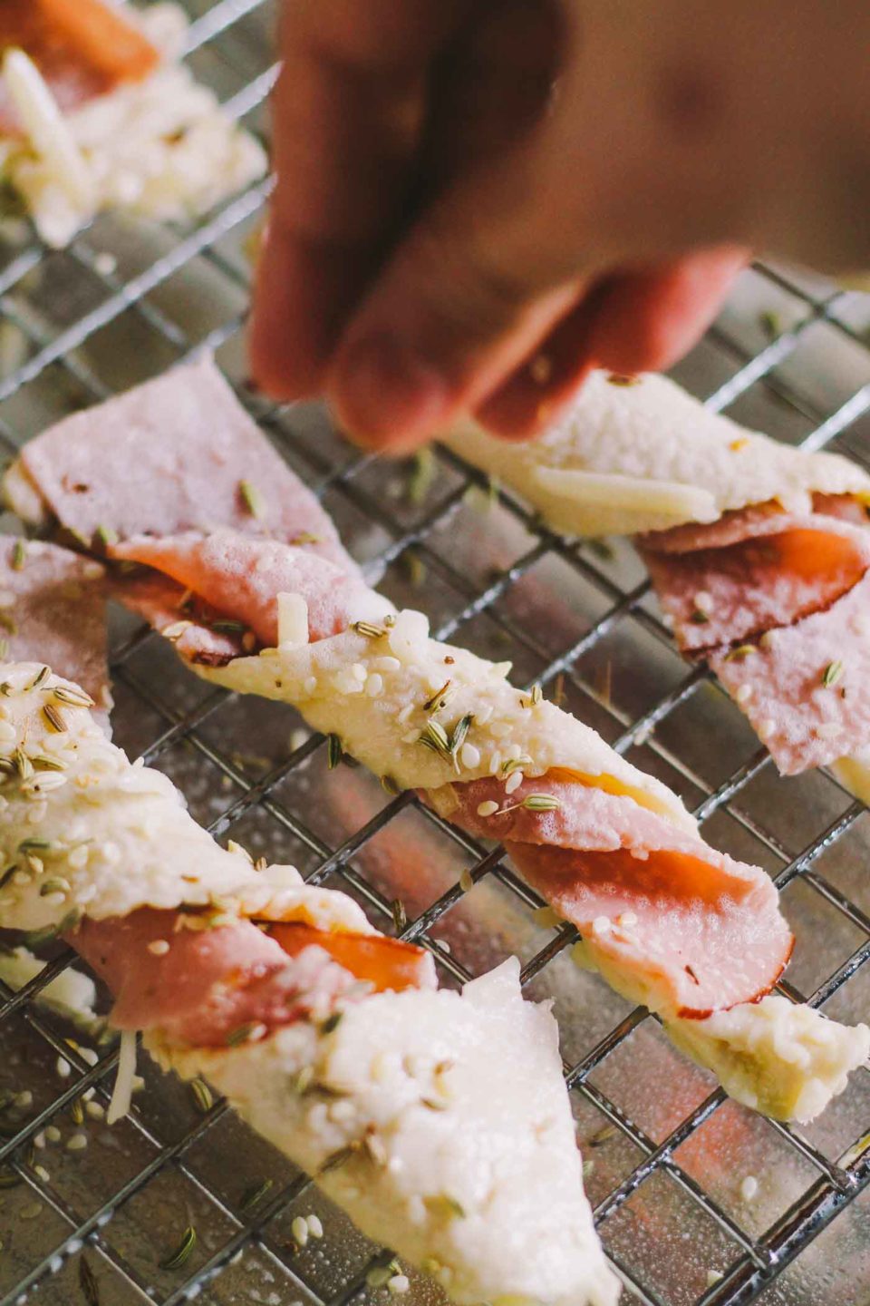 homemade ham & gruyère twists recipe via playswellwithbutter.com | served in bite-sized form, they make a great little snack for an elegant brunch gathering & they're equally delicious when you have friends over for cocktails & appetizers! | brunch ideas, easter ideas, elegant appetizers, easy entertaining |