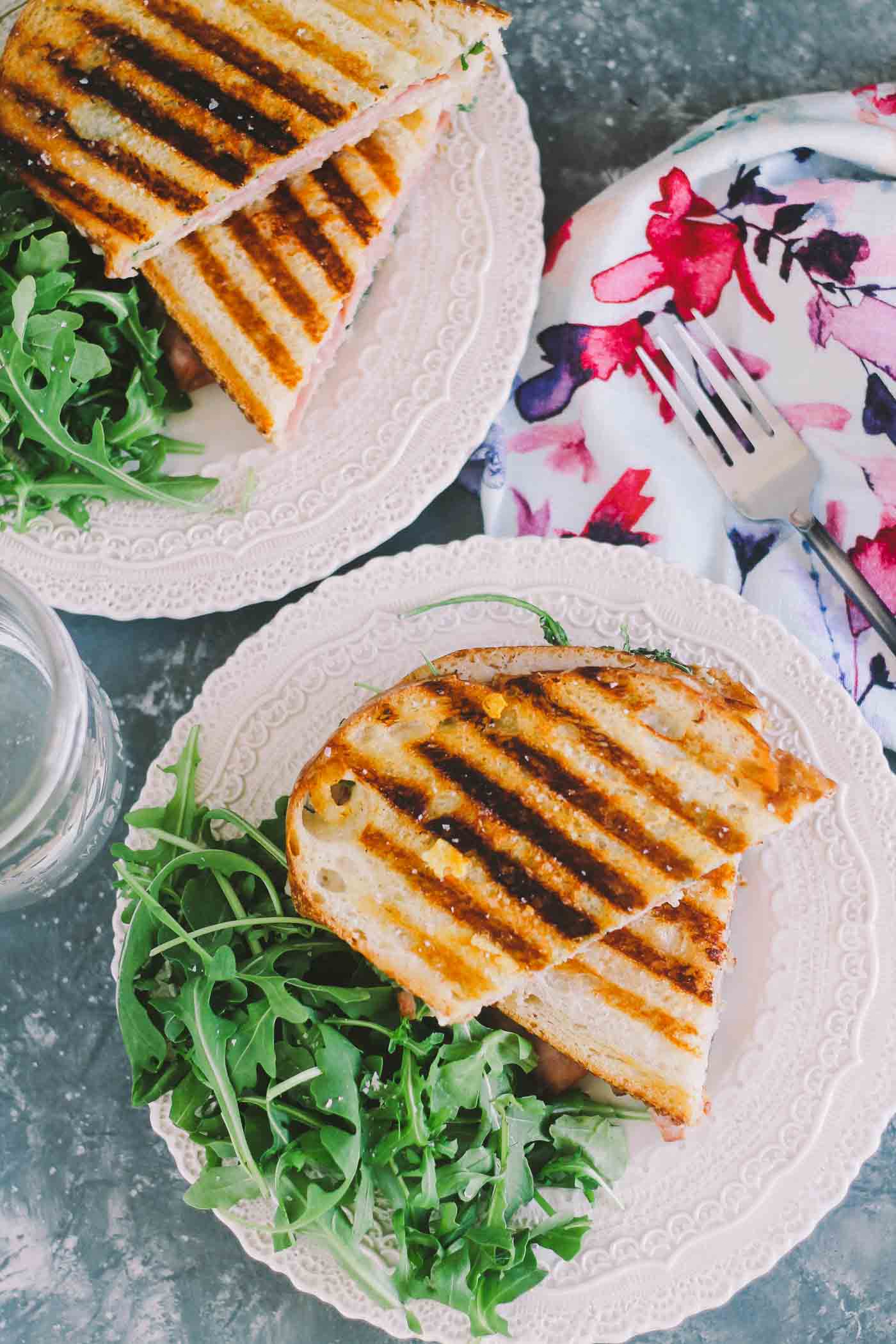 croque monsieur paninis are an easy & delicious lunch or brunch meal. a seriously simple, yet seriously elegant way to use up easter ham leftovers or to entertain a couple of girlfriends for a casual weekend lunch (just don't forget the rosé!) | croque monsieur, sandwich, french recipe, girls night, easy recipe, easter, easy entertaining |