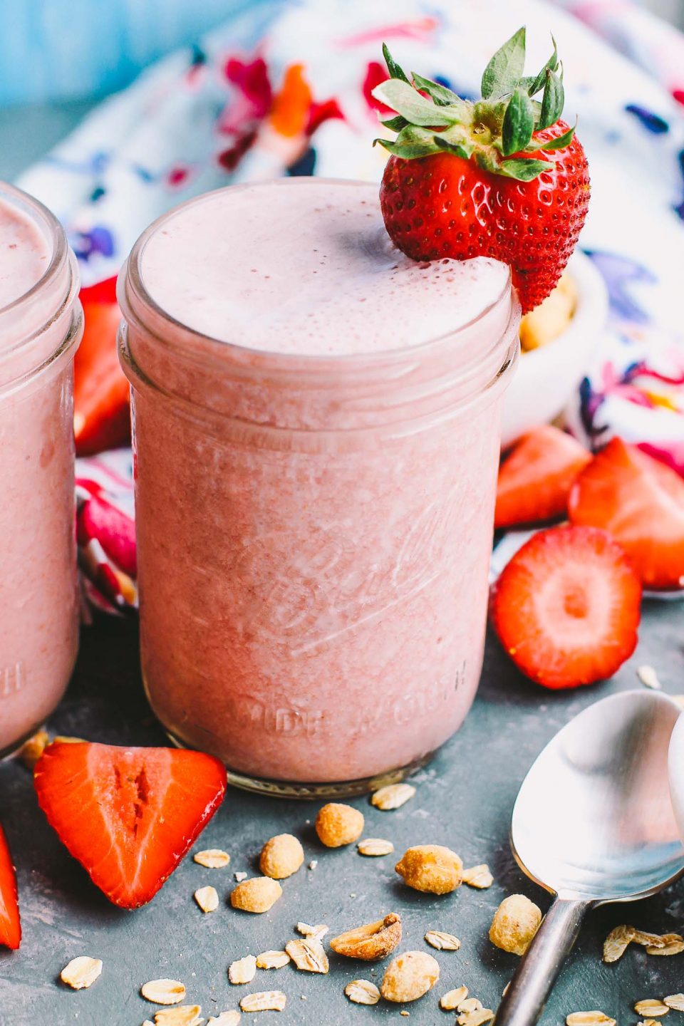 a creamy, delicious smoothie recipe for an easy, healthy breakfast for any busy weekday mornings! these peanut butter & jelly strawberry smoothies are loaded with strawberries, peanut butter, & oats to keep you full until lunchtime. | smoothie, healthy smoothie, protein shake, healthy breakfast, smoothie pack, gluten free, vegan, iifym |