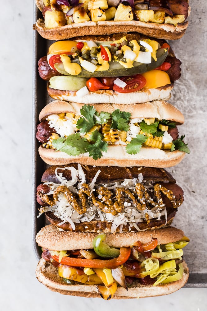 hot dog bar with tons of toppings + 50 recipes for perfect for summer parties! | summer food, summer parties, summer recipes, summer appetizers, summer desserts, summer drinks, easy entertaining, entertaining tips |