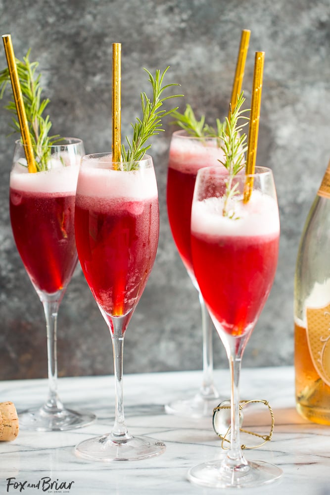 rosé raspberry sorbet mimosas + 50 recipes for perfect for summer parties! | summer food, summer parties, summer recipes, summer appetizers, summer desserts, summer drinks, easy entertaining, entertaining tips |