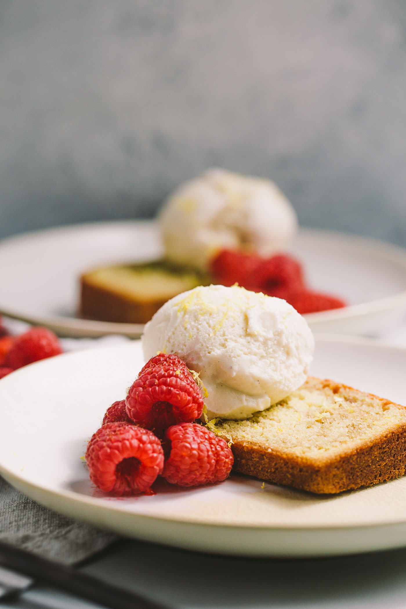 a lemon pound cake swirled with the vibrant flavor of fresh raspberries. topped with a scoop of vanilla bean ice cream, raspberry swirl lemon pound cake is the perfect understated, yet elegant, dessert for summer entertaining.