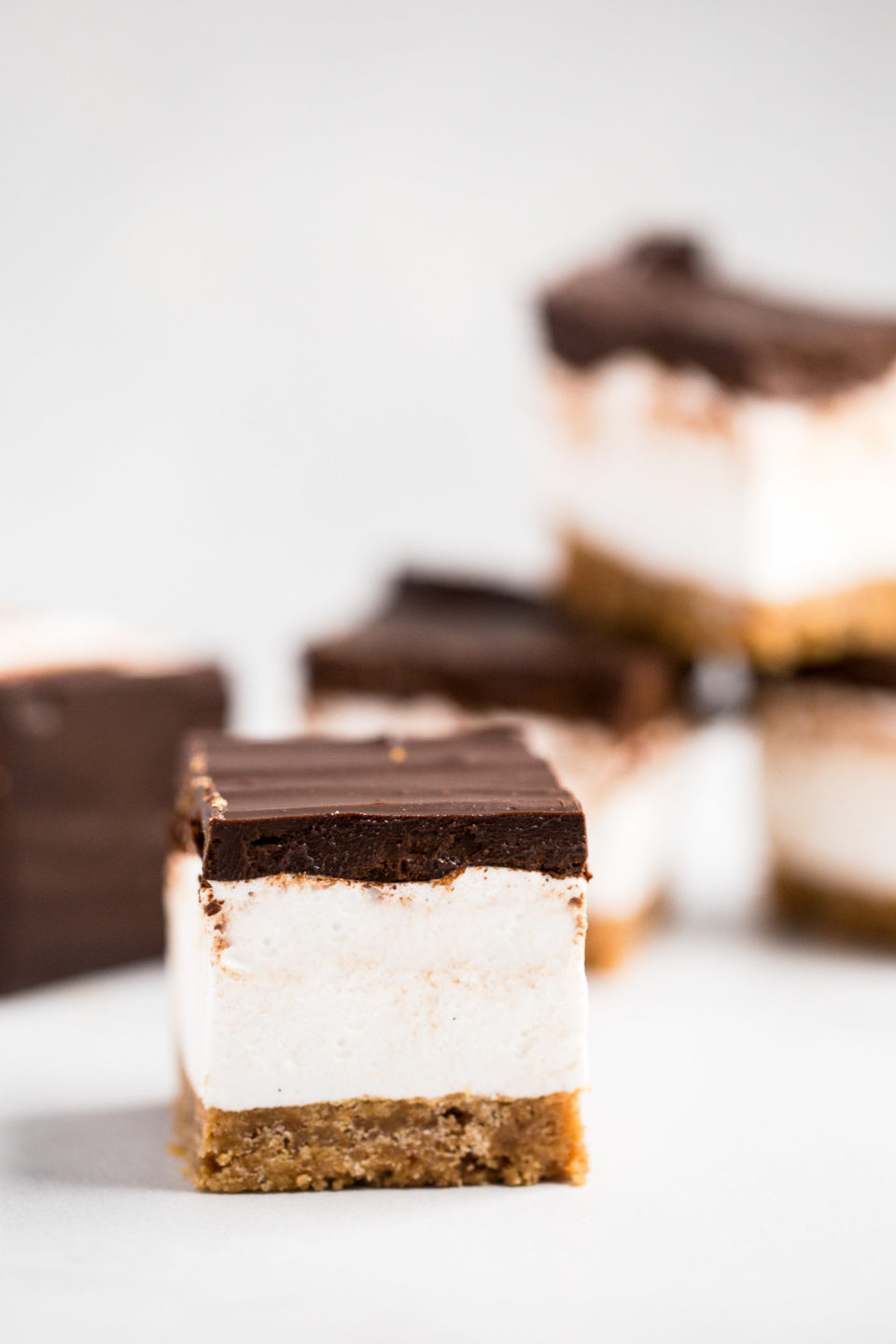 everyone’s childhood summer favorite gets a major update in this recipe for s’mores bars. these s’mores bars sandwich a thick layer of fluffy homemade vanilla bean marshmallow in between graham cracker crust & salted dark chocolate ganache. your favorite campfire treat will never be the same!