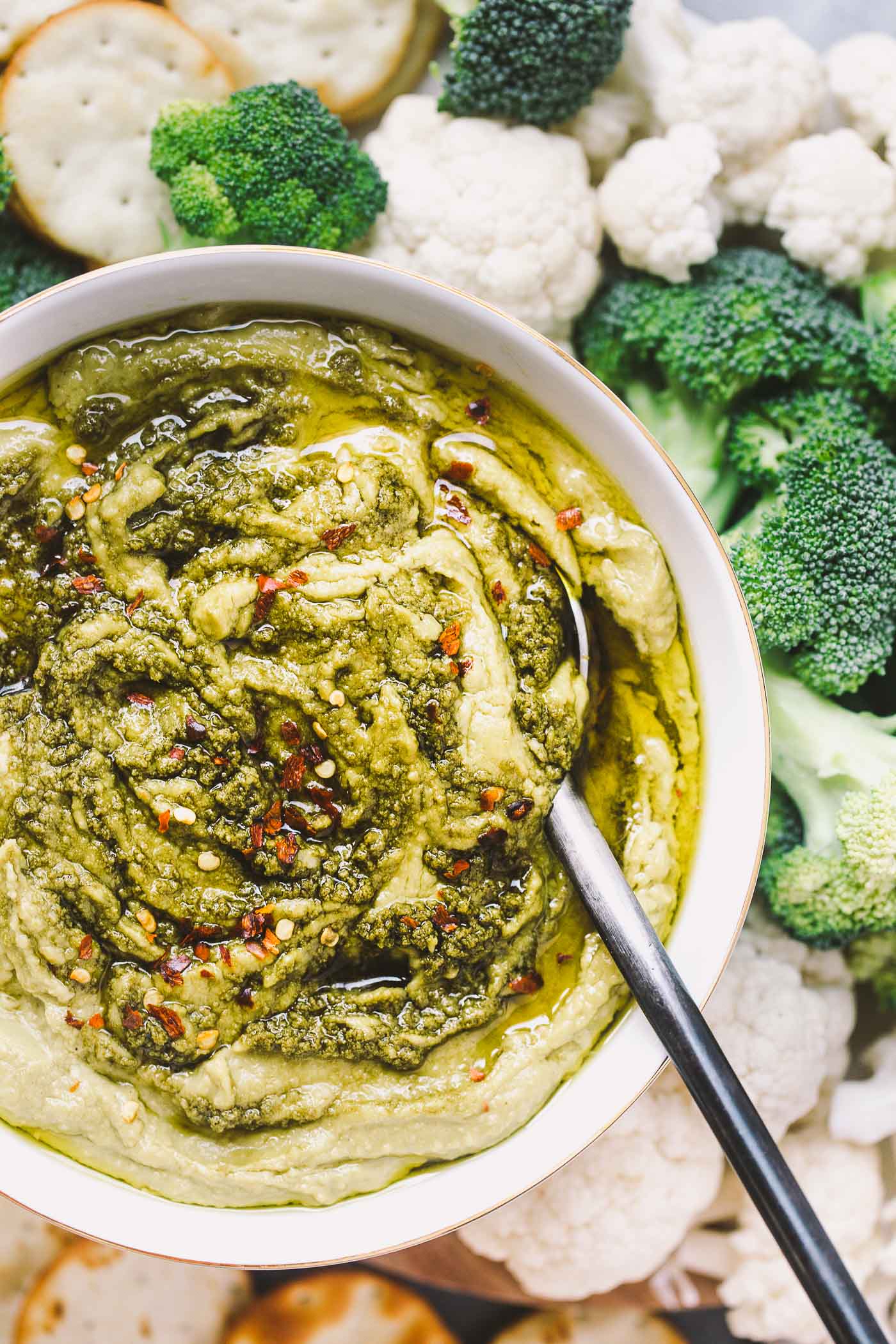 a creamy, dreamy, totally addictive white bean pesto hummus loaded with the bright flavors of pesto & lemon. perfect for healthy end-of-summer snacking!