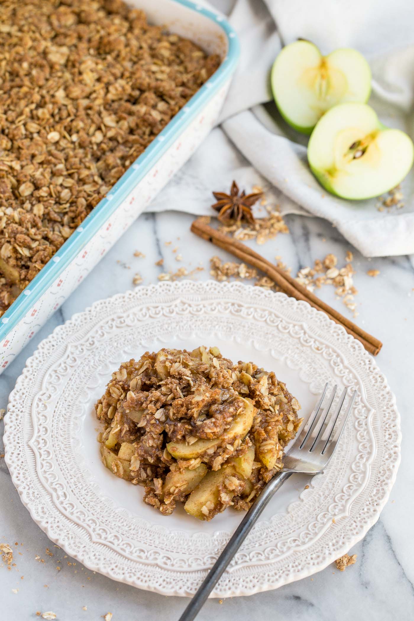 a classic apple crisp updated with the warm flavors of chai, this chai spiced apple crisp is loaded with chai flavor! crisp granny smith apples tossed in a chai spice blend of cinnamon, cardamom, nutmeg, ginger & allspice & baked under a generous layer of homemade crisp. the perfect cozy fall dessert to celebrate all things autumn (especially served warm with a scoop of vanilla ice cream…). #playswellwithbutter #chaispice #applecrisp #chaiapplecrisp #fallbaking #applerecipes