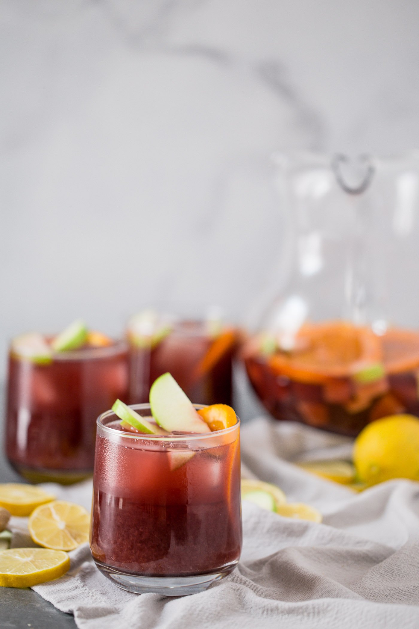 this two buck chuck sangria is an easy & inexpensive red wine sangria recipe featuring trader joe’s famous charles shaw wine. make two buck chuck sangria one pitcher at a time - the perfect drink to serve at girls night, holiday parties, dinner parties, & more! #playswellwithbutter #sangria #drinkrecipe #twobuckchuck #traderjoes #traderjoesrecipe