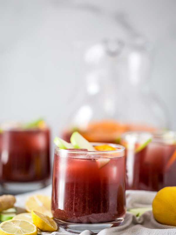 this two buck chuck sangria is an easy & inexpensive red wine sangria recipe featuring trader joe’s famous charles shaw wine. make two buck chuck sangria one pitcher at a time - the perfect drink to serve at girls night, holiday parties, dinner parties, & more! #playswellwithbutter #sangria #drinkrecipe #twobuckchuck #traderjoes #traderjoesrecipe