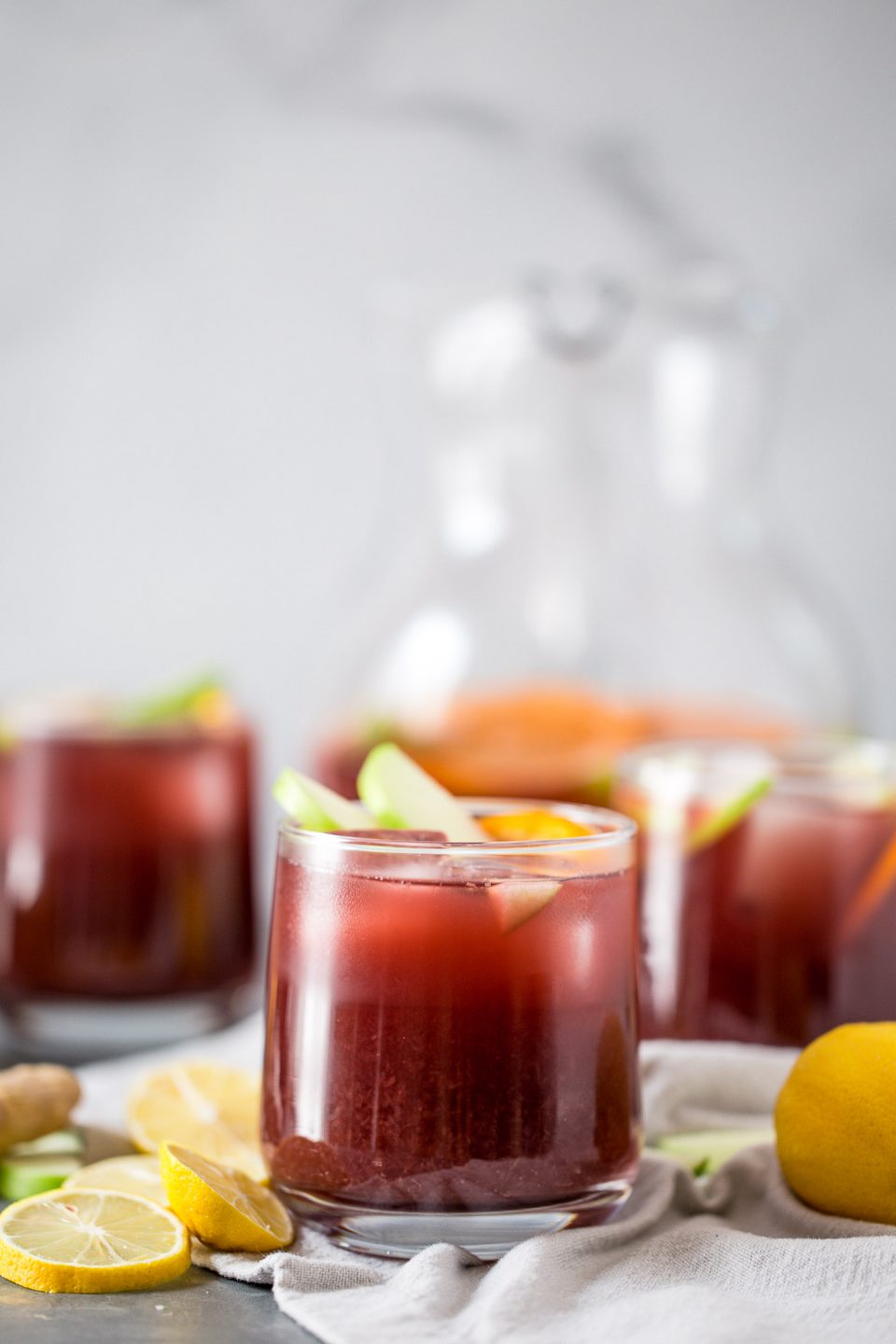 this two buck chuck sangria is an easy & inexpensive red wine sangria recipe featuring trader joe’s famous charles shaw wine. make two buck chuck sangria one pitcher at a time - the perfect drink to serve at girls night, holiday parties, dinner parties, & more! #playswellwithbutter #sangria #drinkrecipe #twobuckchuck #traderjoes #traderjoesrecipe