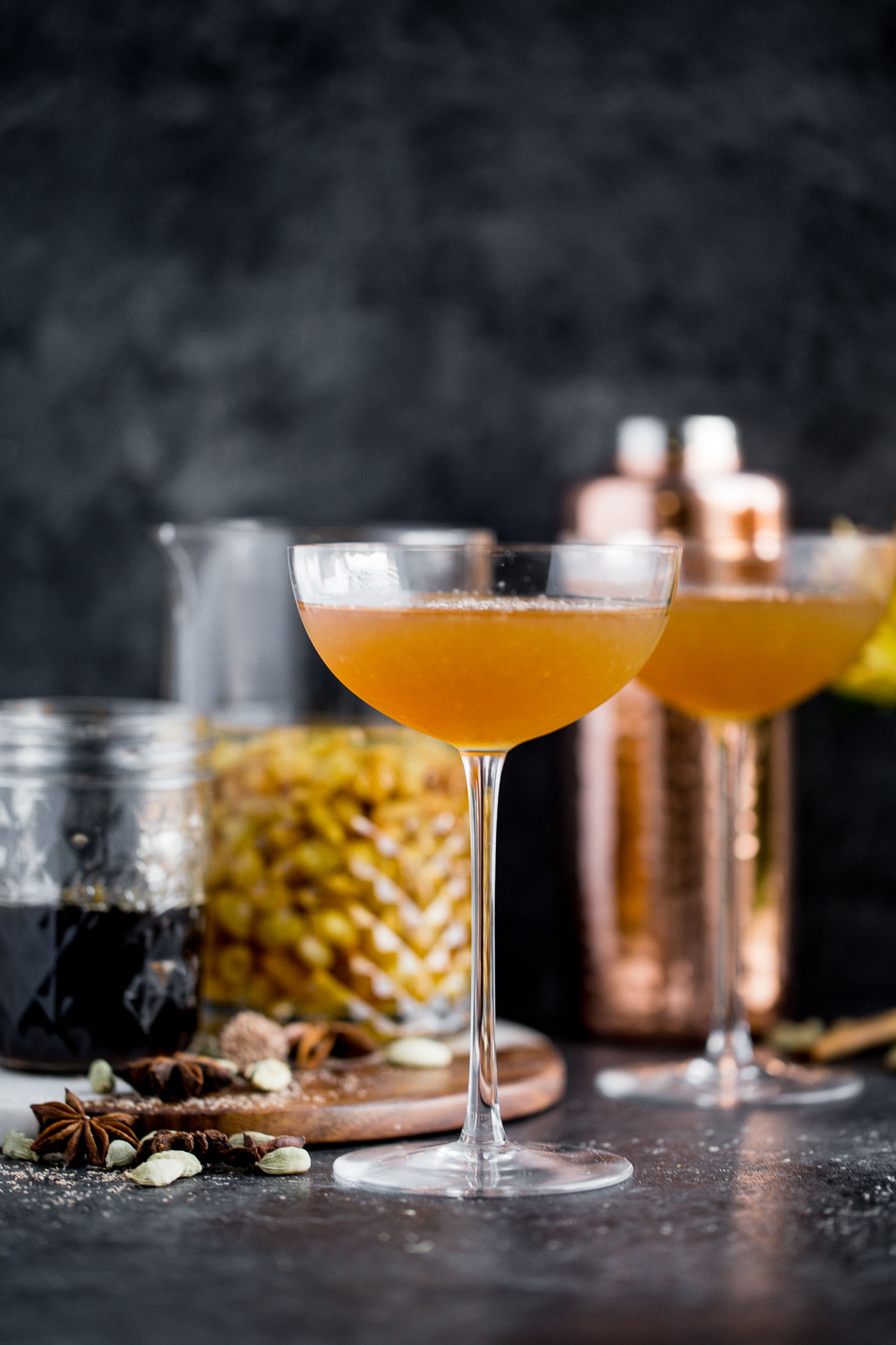 a cozy chai cocktail with golden raisin-infused spiced rum & homemade vanilla chai simple syrup. this chai cocktail is just as perfect for a cozy date night in as it is for celebrating with friends & loved ones this winter season. the perfect cozy winter nightcap. cheers! #playswellwithbutter #chai #rum #hygge #datenightathome #cocktail #cocktailrecipe #wintercocktail #winterdrink #cozycocktail #cozy
