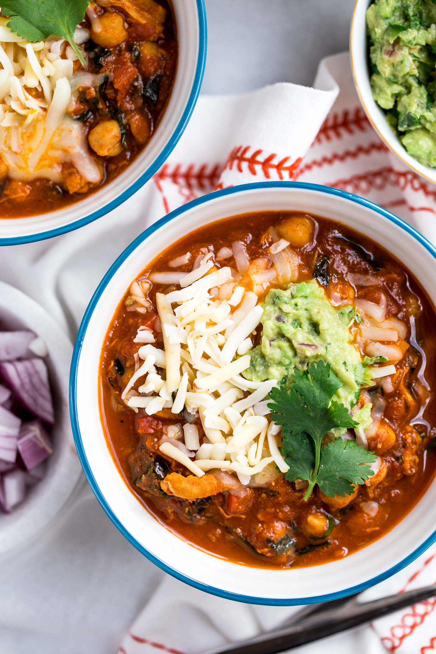 chipotle turkey chili is healthy, comforting, & full of modern flare - smoky heat of chipotle peppers, sweet bites of sweet potato, nutrient-dense kale, & a little touch of cinnamon for some warmth. the perfect cozy comfort food dinner to use up thanksgiving leftovers! #playswellwithbutter #chilirecipe #turkey #comfortfood #thanksgivingleftovers #leftoverturkey