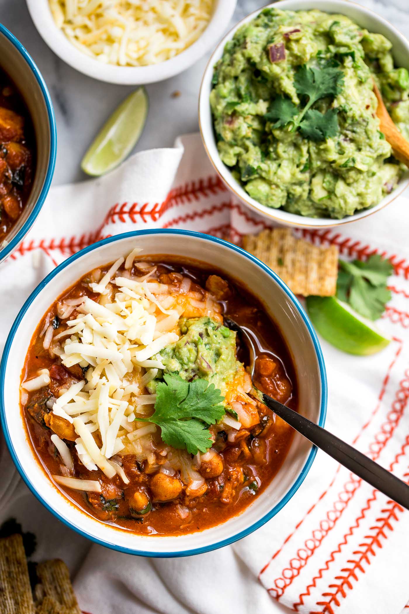chipotle turkey chili is healthy, comforting, & full of modern flare - smoky heat of chipotle peppers, sweet bites of sweet potato, nutrient-dense kale, & a little touch of cinnamon for some warmth. the perfect cozy comfort food dinner to use up thanksgiving leftovers! #playswellwithbutter #chilirecipe #turkey #comfortfood #thanksgivingleftovers #leftoverturkey