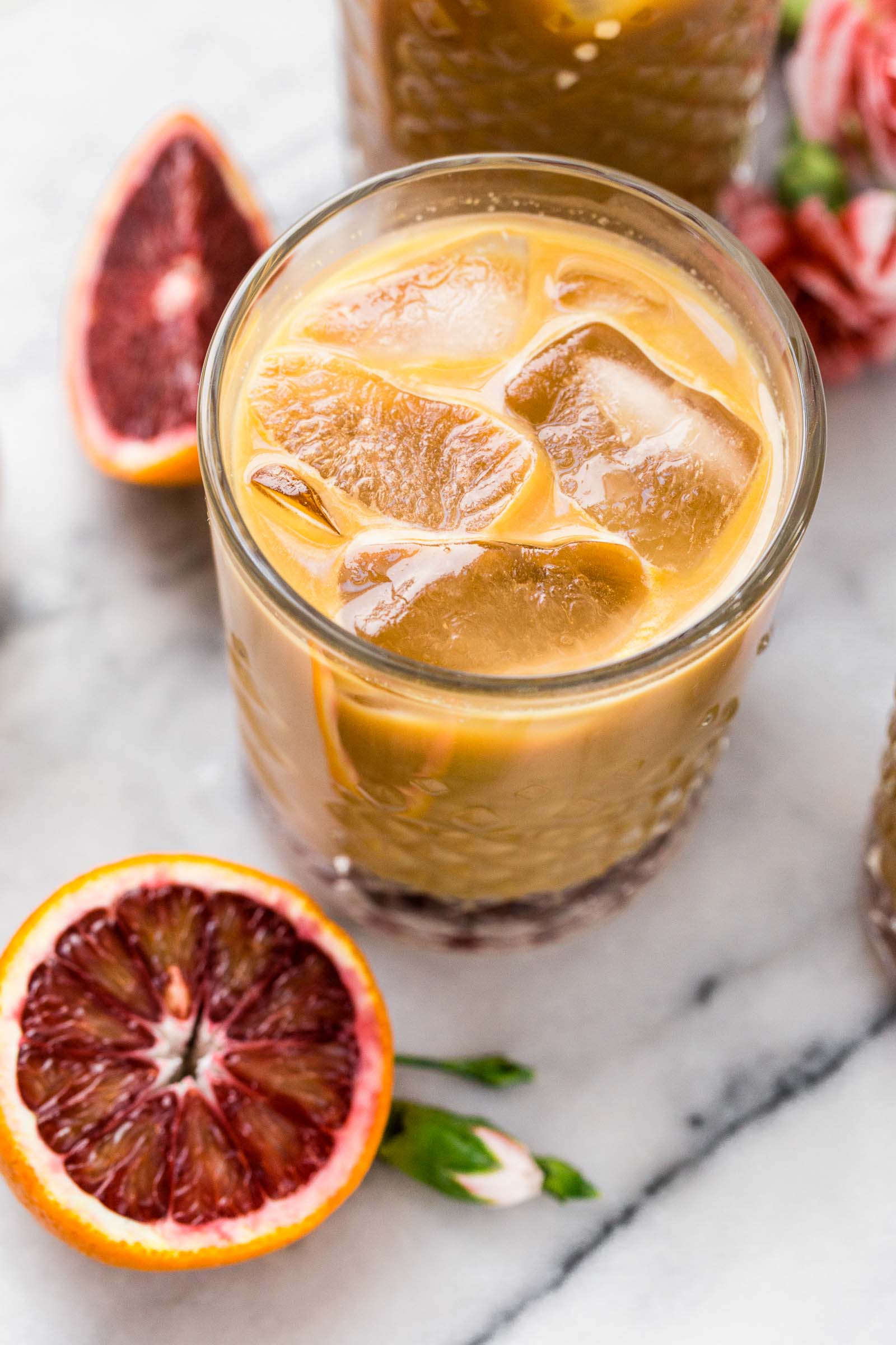 also known as what happens when you spike cold brew coffee with the perfectly not-too-sweet blood orange syrup, blood orange cold brew iced coffee will be your newest winter citrus obsession! #bloodorange #coldbrew #coldbrewcoffee #coldbrewcoffeerecipe #icedcoffee #wintercitrus #playswellwithbutter