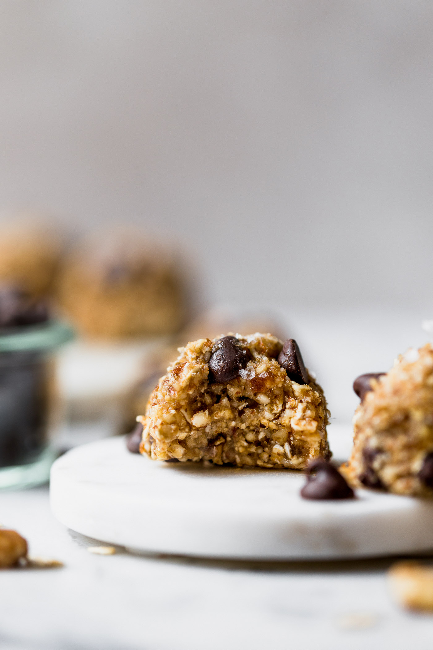 chocolate chip banana bread bliss balls are an easy & totally wholesome snack! inspired by chocolate chip banana bread, but in the form of a healthy, raw energy bite, these chocolate chip banana bread bliss balls are loaded with dates, cashews, almonds, walnuts, and banana. #playswellwithbutter #blissballs #energybites #healthysnack #healthydessert #healthyrecipe #bananabreadbites #bananabread