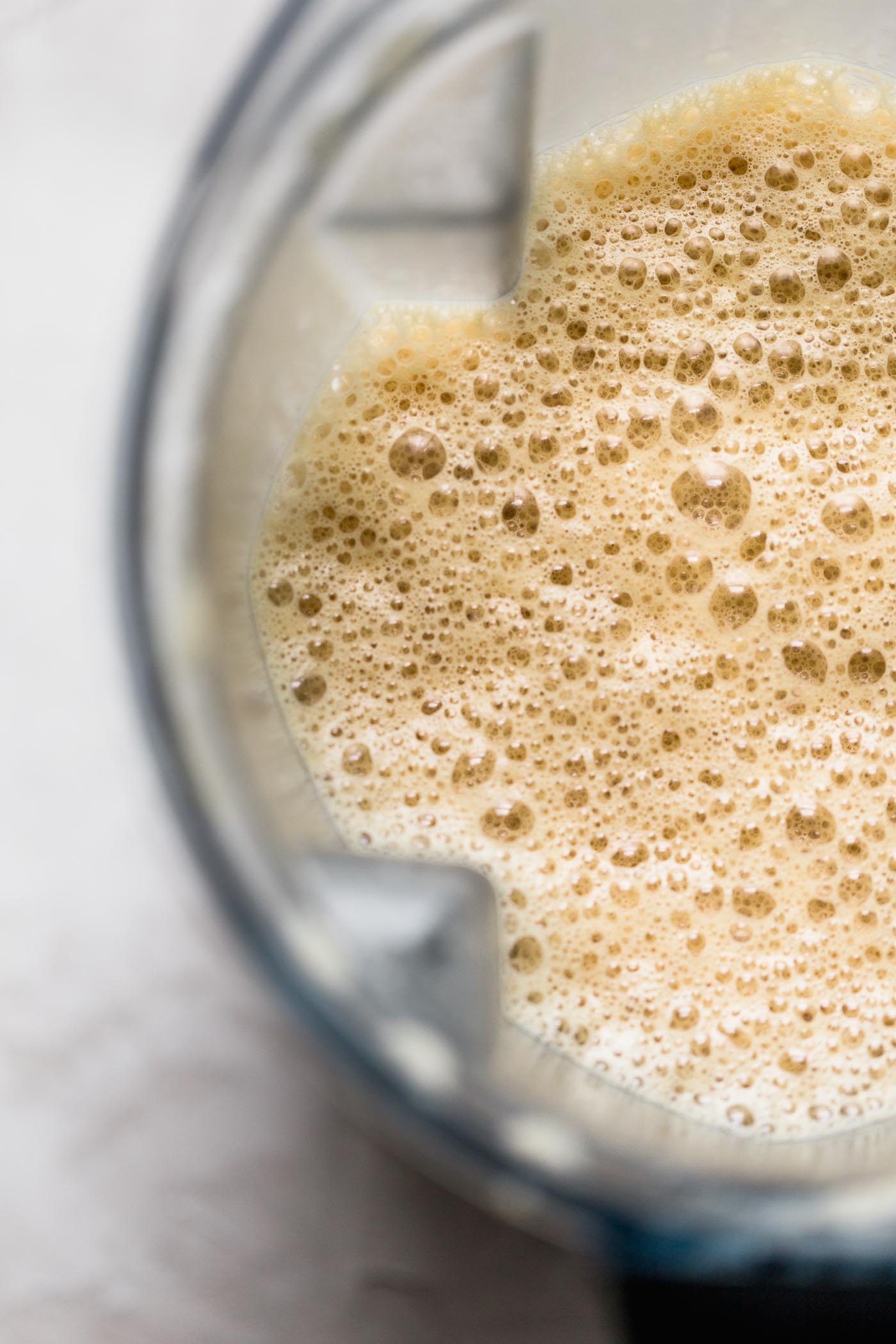 a bulletproof coffee protein latte recipe for a dreamy, creamy, healthy latte that is beyond delicious. this healthy bulletproof coffee latte is full of satisfying protein from your favorite whey or plant-based protein powder & healthy fats from coconut oil. the best part is how completely easy to make at home! paleo friendly. whole30 friendly. #playswellwithbutter #bulletproofcoffeerecipe #proteinlatte #proteindrink #healthycoffeerecipe #healthybreakfast #keto #ketodrink #paleobreakfast #paleodrink