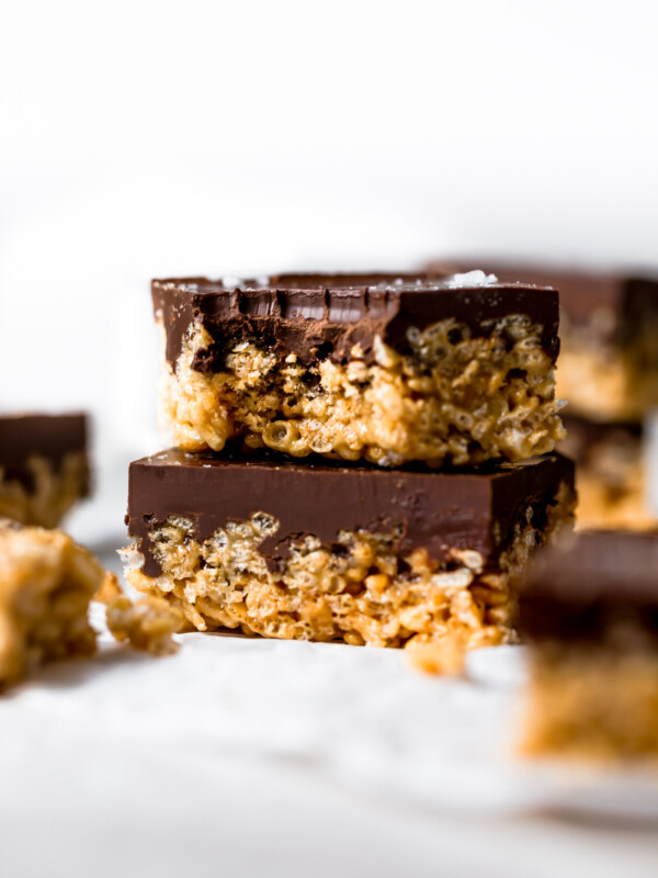 tahini scotcheroos are an update on the classic no-bake summertime dessert we all know & love! these tahini scotcheroos are an allergy-friendly (gluten free, nut free), easy to make treat & they’re perfect for feeding a crowd! #playswellwithbutter #scotcheroos #scotcheroosrecipe #dessert #nobakedessert #nobakebars #allergyfriendly #glutenfreedessert #nutfreedessert
