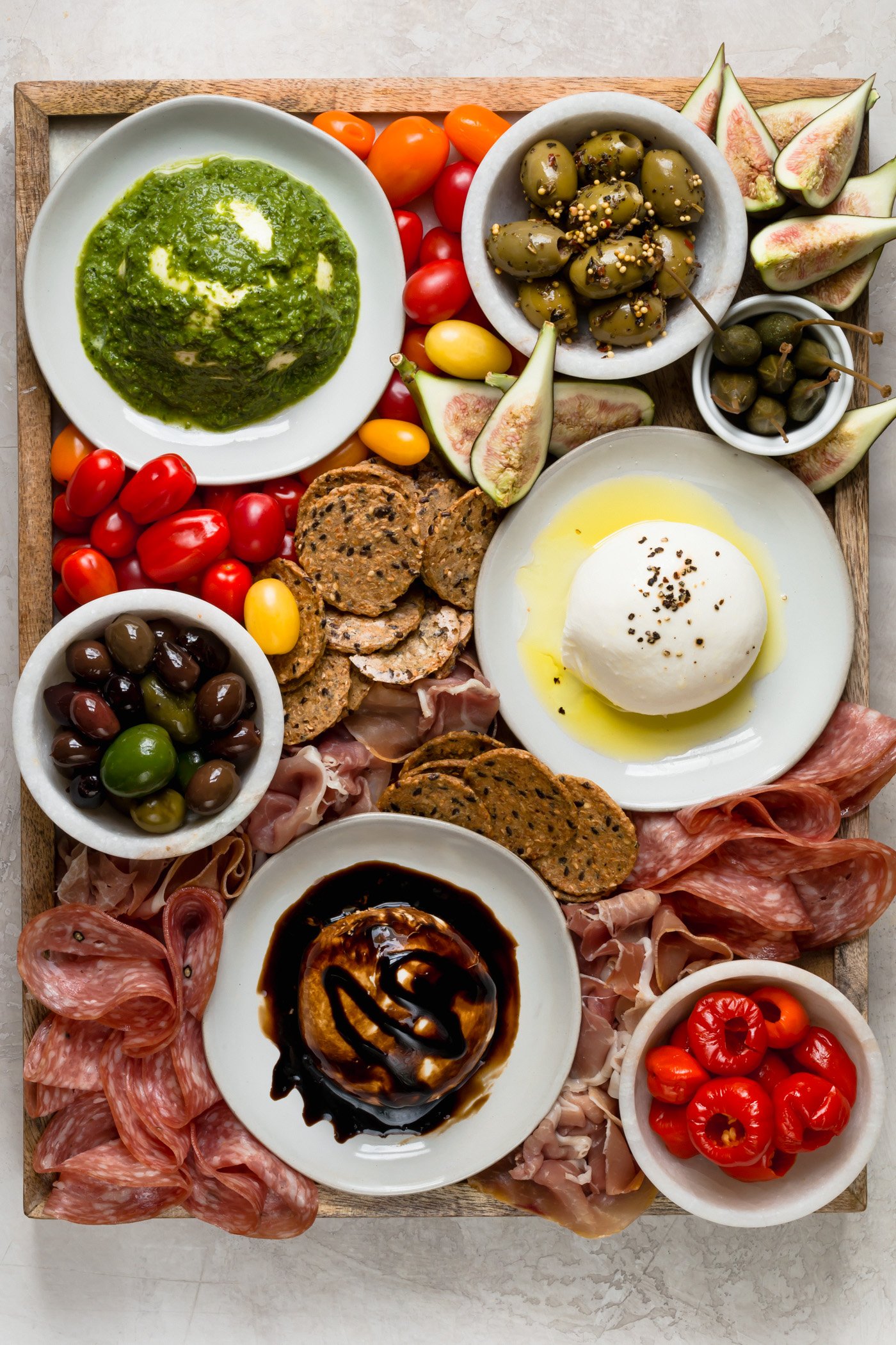 the ultimate burrata cheese board!!! this burrata cheese board has burrata three ways (truffle! balsamic! pesto!) & served alongside all the best cheese board snacks. the perfect easy & totally impressive party snack or dish to share whenever you’re entertaining! #playswellwithbutter #burrata #burrataappetizers #howtoserveburrata #cheeseboard #partyfood #partyappetizers #cheeseboardideas #easycheeseboard #howtomakeacheeseboard 