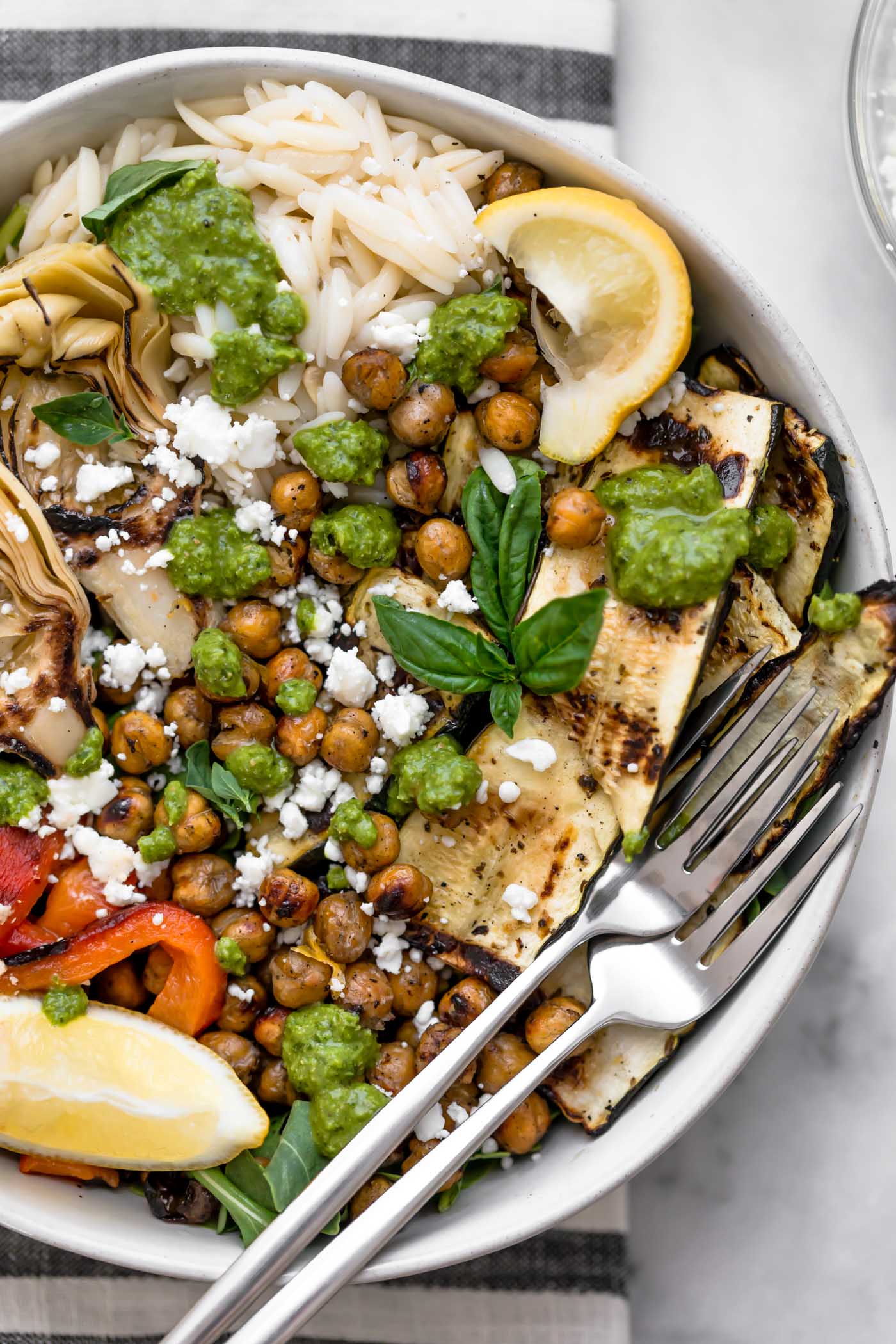 grilled vegetable primavera bowls with pesto & smoky chickpeas! an easy 30-minute vegetarian recipe perfect for the end of summer, with grilled zucchini, grilled bell pepper, grilled artichoke hearts, and smoky grilled chickpeas, plus orzo & lemony pesto. totally healthy, naturally plant-based, easily made gluten-free, & perfect for meal prep! #playswellwithbutter #vegetableprimavera #vegetablerecipes #healthyvegetableprimavera #easydinnerrecipes #healthyvegetarianrecipes #vegetarianmealprep #zucchinirecipes #mealpreprecipes