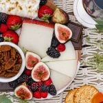 this dessert cheese board is filled with after-dinner cheeses, fresh berries & fall fruits, & includes the perfect wine pairings! the best snacks & appetizers to serve for the ultimate girls night or dinner party this fall. #playswellwithbutter #cheeseboard #dessertcheeseboardideas #cheeseboardideas #girlsnightideas #girlsnightsnacks #girlsnightappetizers #cheeseboardforfall #cheeseboarddisplay #howtomakeacheeseboard