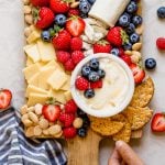 a summer berry cheese board filled with strawberries, raspberries, blueberries, & the perfect cheeses to pair with cheese boards. this summer berry cheese board is an easy & fun appetizer or snack to serve at parties & barbeques all summer long! #playswellwithbutter #summerberrycheeseboard #cheeseboard #summercheeseboard #cheeseboardidea #appetizer #appetizersforparty #easyappetizers #makeaheadappetizers