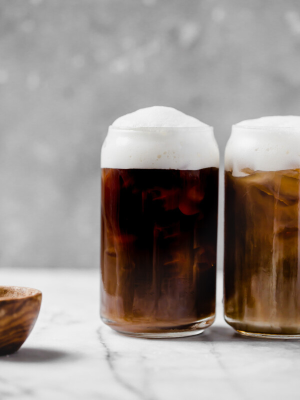 an easy & natural recipe for homemade starbucks salted cream cold foam cold brew with only 4-ingredients! cold brew coffee, lightly sweetened with maple syrup, topped with a creamy salty-sweet cold foam, this salted cream cold foam cold brew coffee is the perfect salty-sweet coffee drink! #playswellwithbutter #saltedcreamcoldfoamcoldbrewcoffee #coldbrew #coldbrewcoffeerecipe #icedcoffee #easycoffeerecipe #starbucksdrinks #starbucksrecipe