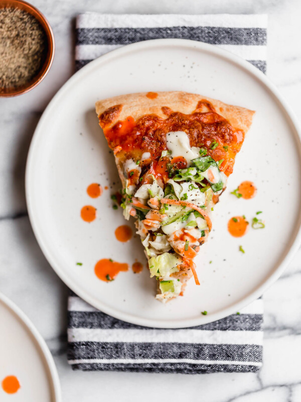 easy buffalo chicken bacon ranch pizza. the easiest buffalo chicken bacon ranch pizza, topped with a fresh & crunchy salad for a fun twist on pizza night! with only 5 ingredients, this buffalo chicken bacon ranch pizza is perfect for an easy weeknight pizza dinner & great for game day parties this fall! #playswellwithbutter #homemadepizza #buffalochickenpizza #chickenbaconranchpizza #pizzanight #easypizzarecipe #easydinnerrecipe #gamedayfood #partyfood