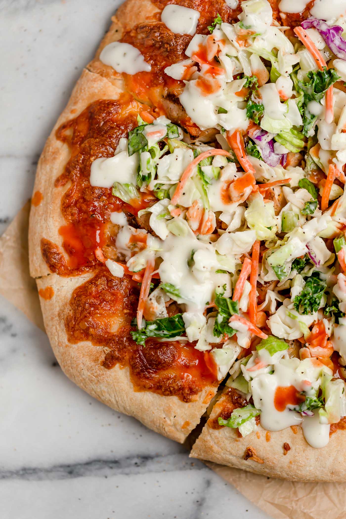 easy buffalo chicken bacon ranch pizza. the easiest buffalo chicken bacon ranch pizza, topped with a fresh & crunchy salad for a fun twist on pizza night! with only 5 ingredients, this buffalo chicken bacon ranch pizza is perfect for an easy weeknight pizza dinner & great for game day parties this fall! #playswellwithbutter #homemadepizza #buffalochickenpizza #chickenbaconranchpizza #pizzanight #easypizzarecipe #easydinnerrecipe #gamedayfood #partyfood