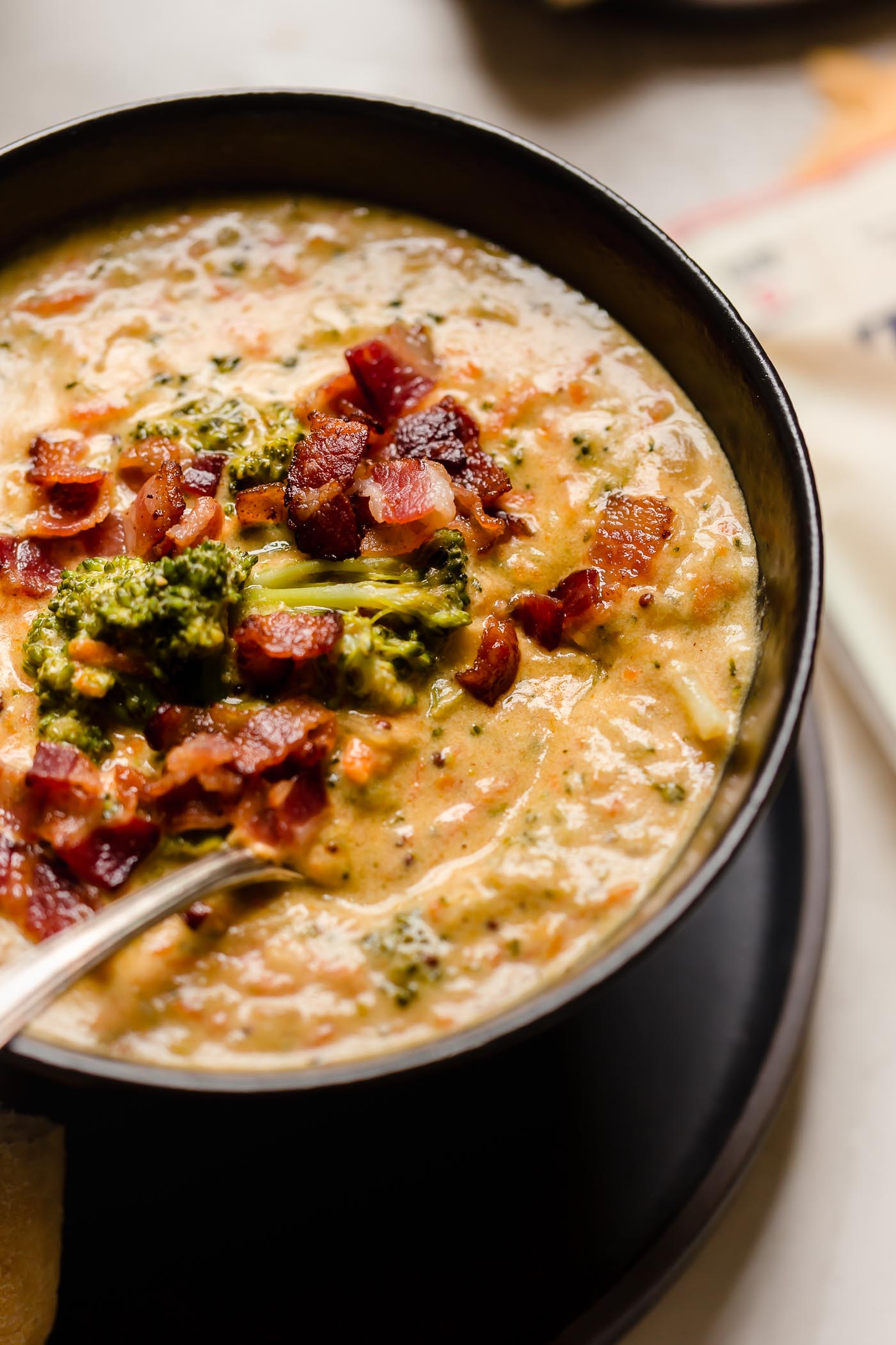 bacon beer cheese broccoli cheddar soup. a cross between two classic comforting soups, beer cheese soup & broccoli cheese soup, this bacon beer cheese broccoli cheddar soup is thick, luscious, creamy, & decadent. the ultimate comfort food dinner to warm you up on a cold night this winter! #playswellwithbutter #broccolicheddarsoup #broccolicheesesoup #bestbroccolicheesesoup #creamybroccolicheesesoup #beercheesesoup #bestbeercheesesoup #baconbeercheesesoup #comfortfood #comfortfoodrecipes
