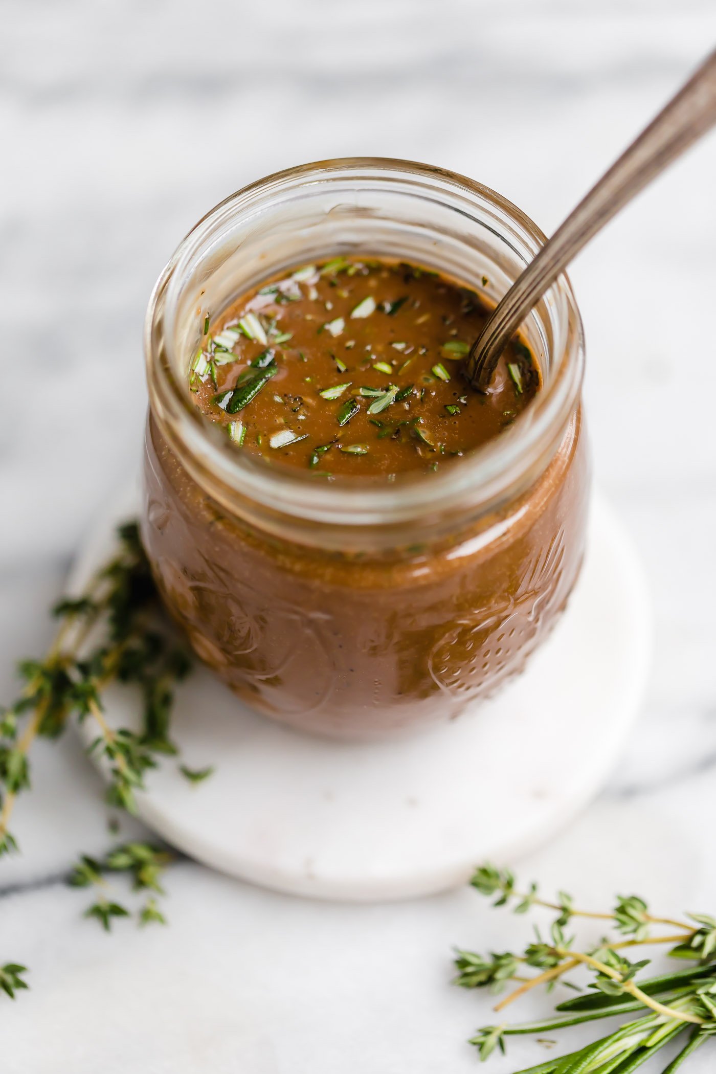 maple balsamic vinaigrette. a simple, but delicious balsamic vinaigrette recipe with pure maple syrup and freshly chopped rosemary & thyme. it takes less than 5 minutes to prep this quick & creamy balsamic vinaigrette, & it’s sure to take any salad to the next level! #playswellwithbutter #balsamicvinaigrette #balsamicvinaigrettedressing #balsamicdressing #saladdressingrecipes #saladdressing #creamybalsamicdressing