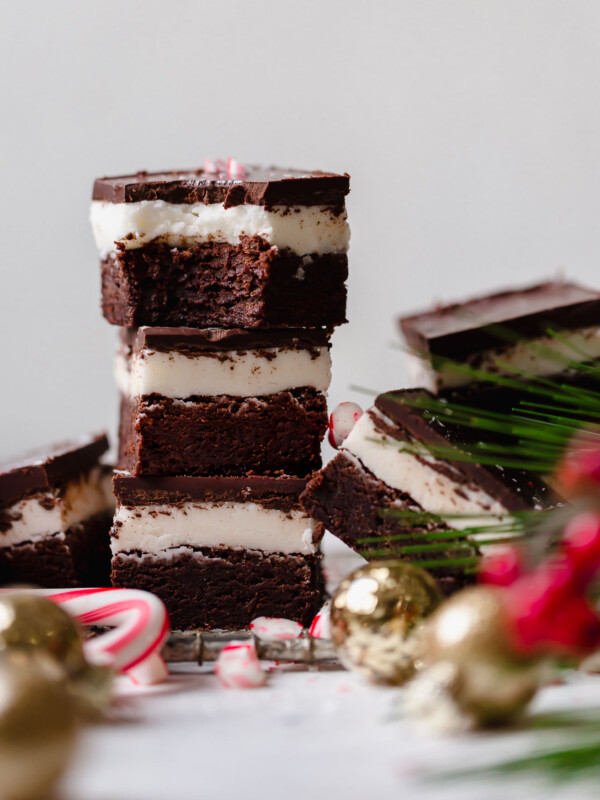 dark chocolate peppermint brownies recipe. extra fudgy dark chocolate brownies topped with homemade peppermint frosting & an easy chocolate glaze. the ultimate easy recipe for a festive holiday dessert! #mintbrowniesrecipe #classicmintbrownies #mintbrowniesfromscratch #mintfrosting #bestmintbrownies #christmascookies #christmasdesserts #darkchocolate #browniesfromscratch #brownieseasy #holidaybaking