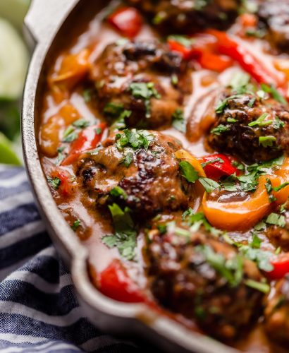 skillet red curry with ginger turkey meatballs. the creamiest red curry with onions, bell peppers, & flavorful turkey meatballs made with tons of ginger, garlic & cilantro - & the best part is it’s all made in one pan! an easy & comforting skillet red curry recipe! #playswellwithbutter #redcurry #easyredcurry #turkeymeatballs #gingermeatballs #healthyrecipe #castiron #skilletrecipe #onepandinners #onepanmeal #castironrecipe