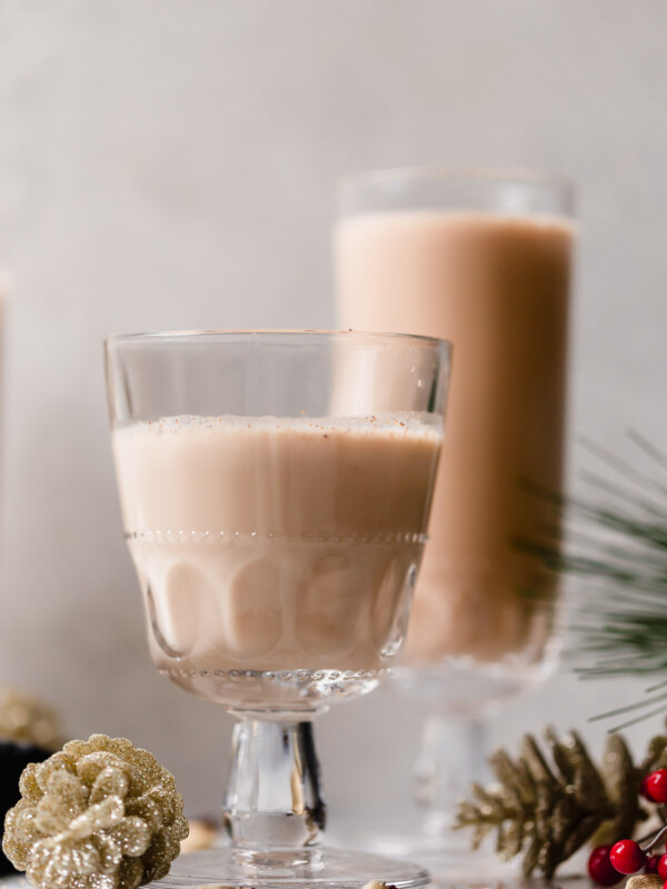 smoky spiked coconut chai tea latte. an easy spiked chai tea recipe! a coconut chai tea latte, lightly sweetened with maple syrup & spiked with mezcal & tequila. an easy & cozy boozy chai tea that’s perfect to warm up on a cold winter night during the holiday season. #playswellwithbutter #spikedchaitea #spikedchailatte #spikedchai #chaicocktail #coconutchai #easycocktailrecipes #fallcocktailrecipes #wintercocktailrecipes #holidaycocktailrecipes #christmascocktailrecipes #mezcalcocktails