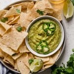 a classic salsa verde recipe with a twist, this creamy salsa verde is full of bright flavors (from tomatillos, peppers, cilantro, & lime juice), & gets tons of creaminess from avocado. this creamy salsa verde recipe is easy to make, & even easier to eat! say hello to your new favorite game day snack! #playswellwithbutter #salsaverde #easysalsaverderecipe #creamysalsaverde #tomatillosalsa #tomatillorecipes #tomatillosauce #easyveganrecipes #vegansnack #gamedaysnacks #gamedayappetizer #gamedayfood