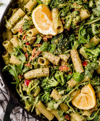 creamy vegan pasta made in 25 minutes or less!!! perfectly al dente vegan pasta tossed with sauteed bell pepper, broccoli, sundried tomatoes, & an easy homemade lemony basil creamy vegan pasta sauce made from cashews. the easiest healthy pasta recipe - totally dairy-free, vegan & filled with veggies! #creamyveganpasta #easycreamyveganpastasauce #veganrecipes #vegandinner #easyveganrecipes #healthyveganrecipes #plantbased #veganpasta #dairyfree #dairyfreerecipes