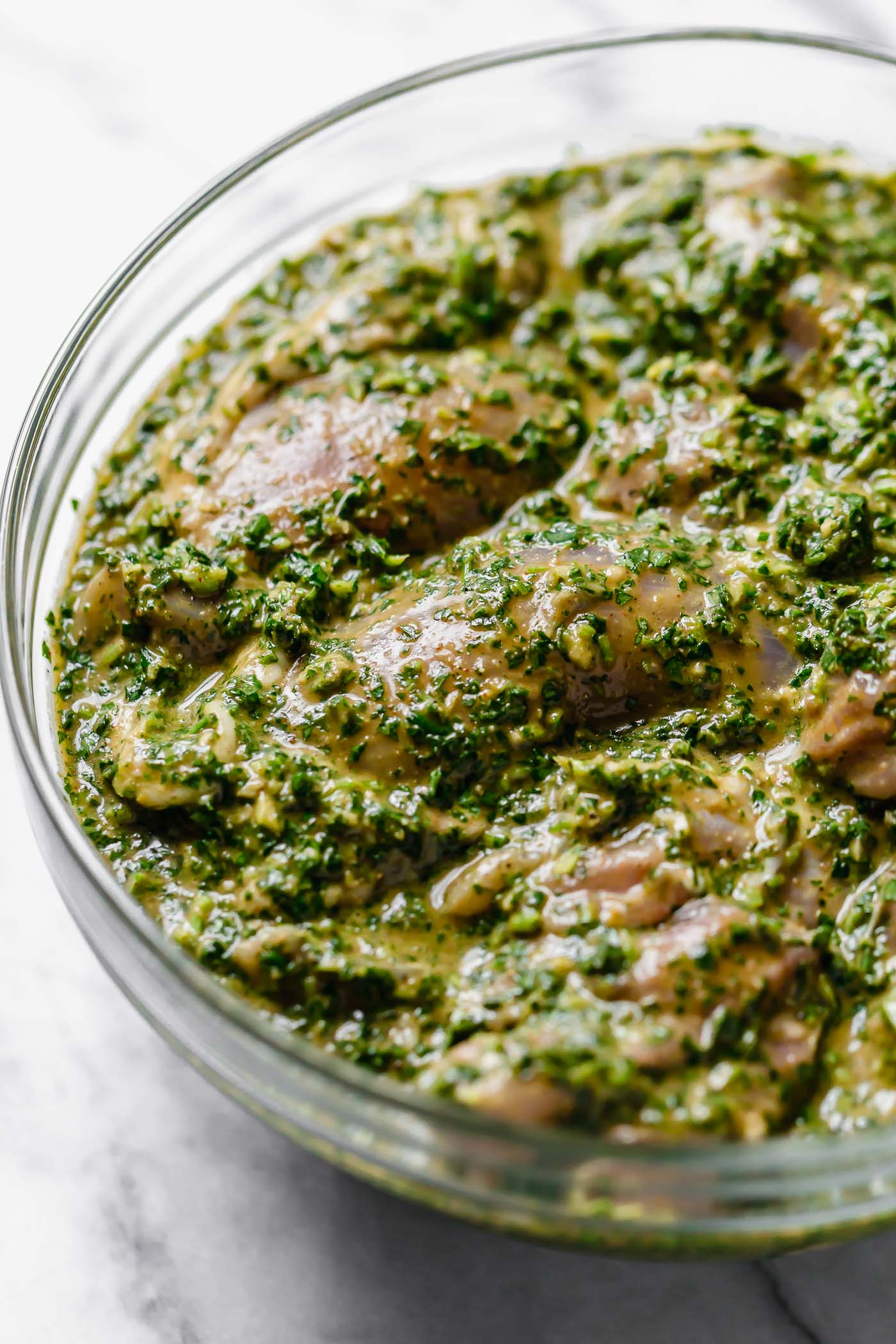 Similar to chimichurri, chermoula is packed with garlic & punchy fresh herbs (like cilantro, parsley, mint), but it also has a hint of warmth from spices common in North African & Middle Eastern cooking (cumin & coriander ftw!). It’s traditionally served over grilled fish...but I’m pretty sure once you have it you’ll want to put it on everythaaang. #playswellwithbutter #chermoula #chermoulasauce #morrocanfood #morrocanrecipes #marinaderecipe #easymarinade #grillingrecipes #chickenmarinade