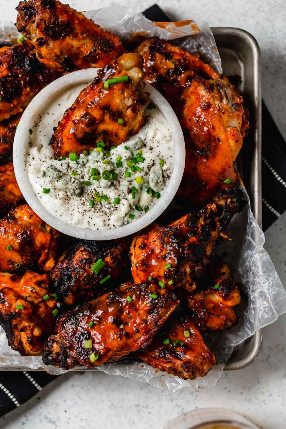 best grilled chicken wings recipe (3 ingredients) | my grilled buffalo chicken wings recipe (grilled hot wings!) stay juicy from a secret step & ingredient! plus my exact steps for how to grill chicken wings. #playswellwithbutter #chickenwings #grilling #chickenwingsrecipe #grilledchicken #easychickenwings