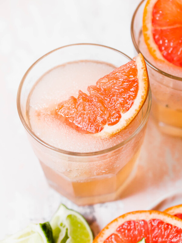 frose palomas in glass with grapefruit garnish