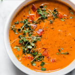 Creamy Roasted Red Pepper Soup with graphic text overlay for Pinterest.
