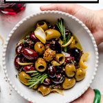 Marinated Olives recipe with graphic text overlay for Pinterest