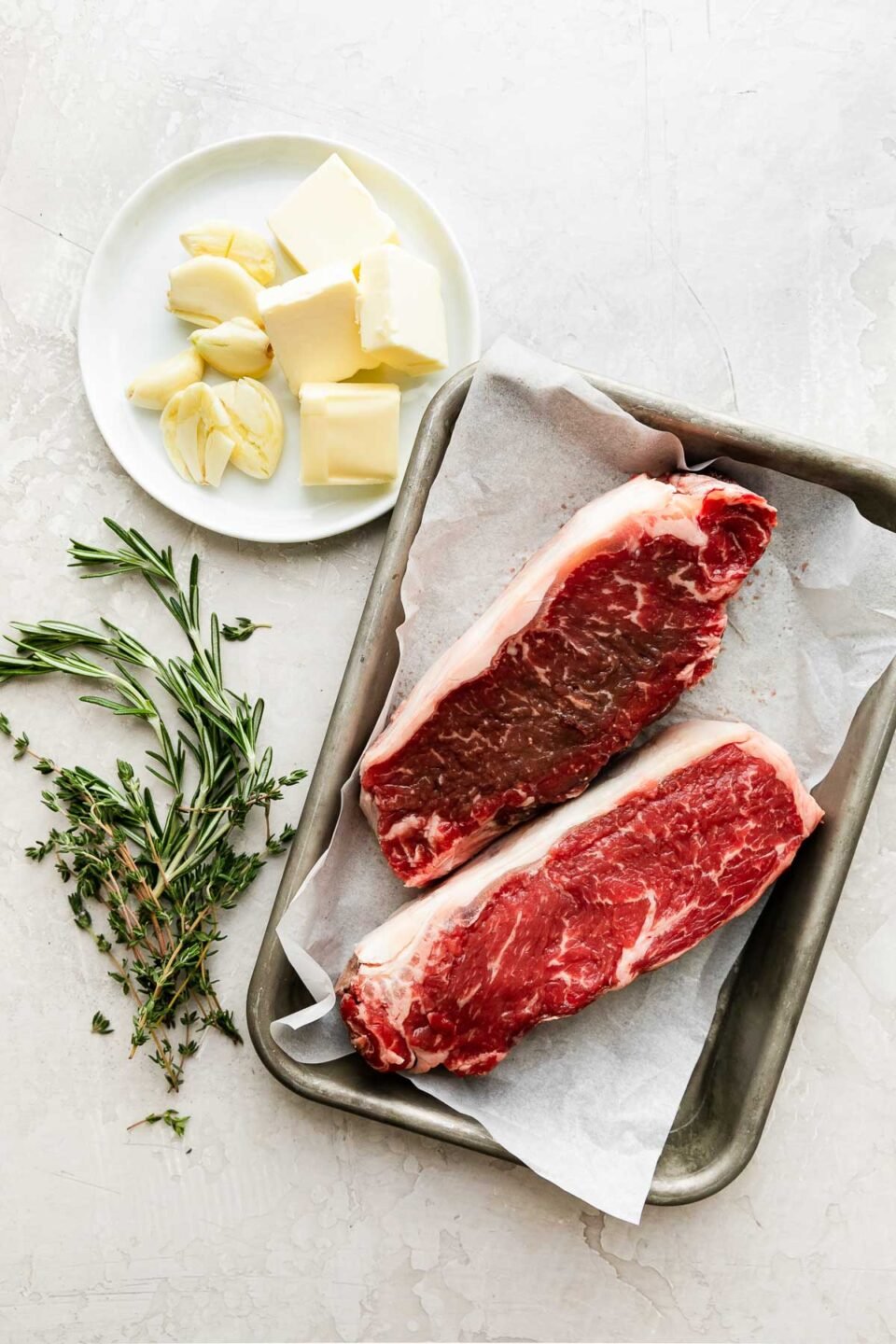 https://playswellwithbutter.com/wp-content/uploads/2022/05/Perfect-Grilled-Steak-Butter-Basted-with-Herb-Brush-1-960x1440.jpg