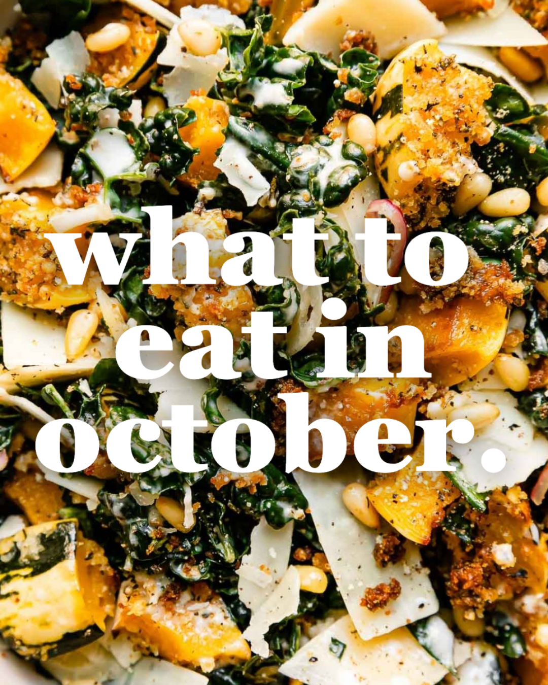 A close-up of a fall salad with kale, roasted squash, pine nuts, shaved cheese, and breadcrumbs, overlaid with bold white text reading what to eat in october.