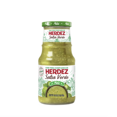 A glass jar of Herdez Salsa Verde with a green lid and label featuring tomatillos and peppers, labeled “Mild.” The jar contains green salsa and weighs 16 ounces (453 grams).