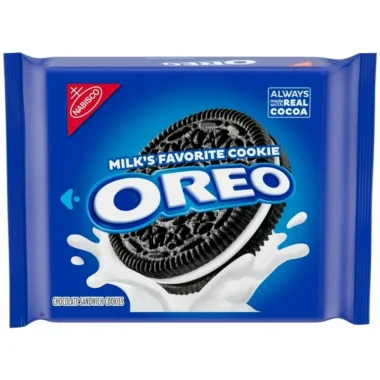 A blue package of Oreo cookies featuring an image of a chocolate Oreo cookie splashing into milk, with the text Milks Favorite Cookie and Always Made With Real Cocoa displayed on the front.